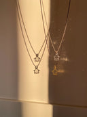 Casetta stilizzata con cuore montata su catena modello a pallini diamantati in argento 925