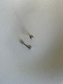 Piercing labret triangolo