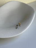 Piercing labret triangolo