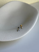 Piercing labret triangolo